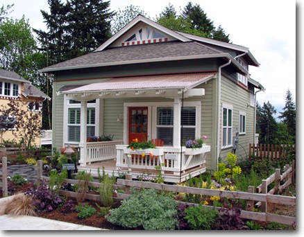 I love this little house with the big front porch (or at least porportionally so).
